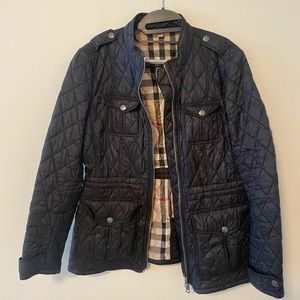 Burberry Brit black quilted jacket. 6 pockets, double zipper, drawstring waist